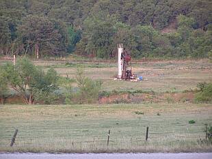 Scrub land and an oil well